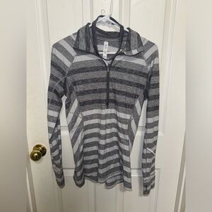 Grey, and white stripped quarter zip. Also, added is a lululemon headband.